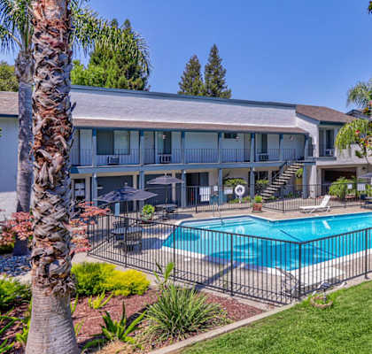 A large house with a pool in the backyard.