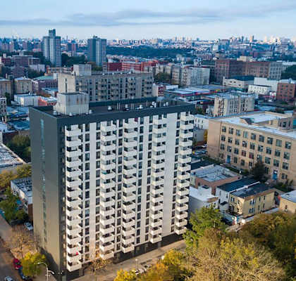 an aerial view of a tall building in a city at Clinton Towers, New York