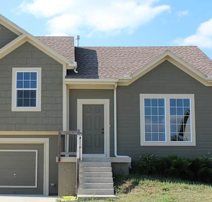 the front of a house with a garage door