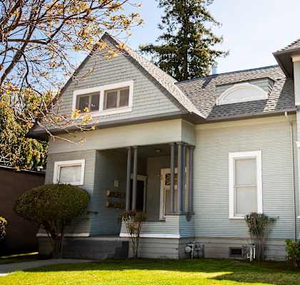 A grey blue house with a sidewalk leading to the front door, the front view of 446 Forest Ave Palo Alto CA  Prodesse Property Group