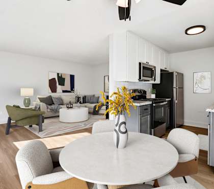A modern kitchen with a dining table and chairs.