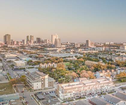 an aerial view of the city with the skyline in the background