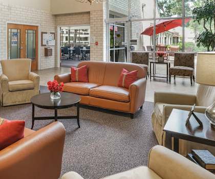 lobby of Sundale Manor Senior Apartments with lots of plush furniture for sitting