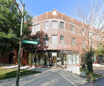 a brick building on the corner of a street