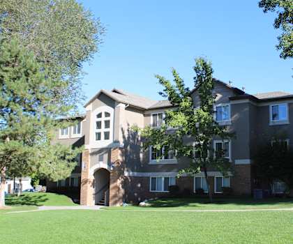 a large house with a lawn in front of it