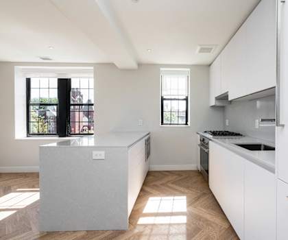 High end appliances in an open concept kitchen with great lighting