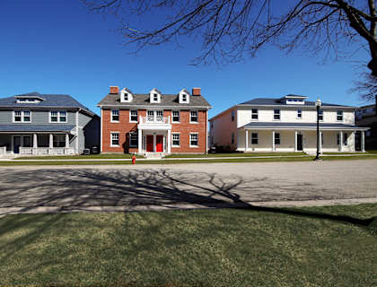 a group of houses on the side of a street