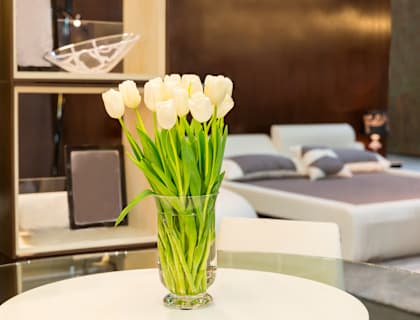 A vase of white tulips sits on a table at Tabco Towers Apartments, Maryland