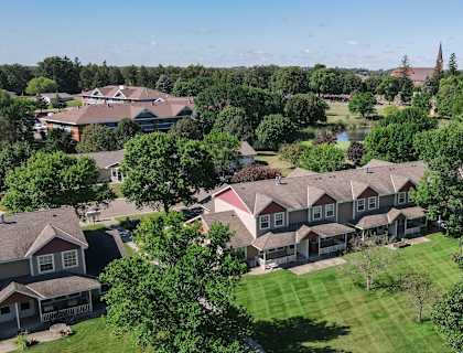 A bird's eye view of a residential area with houses and trees.