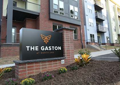 The Gaston at North End is a residential building with a sign in front.