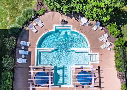 Seasonal pool and tanning deck within steps from your apartment backdoor. Enjoy luscious green space and the beauty of nature every day at Alexander Heights.