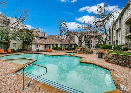 the swimming pool at the preserve at polo terrace apartments