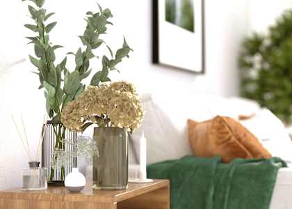 a vase with flowers on a table in a living room