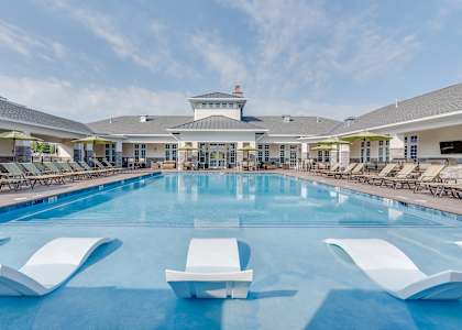 A large indoor swimming pool with sun loungers at Waterstone at Hamburg Apartments, Kentucky, 40509