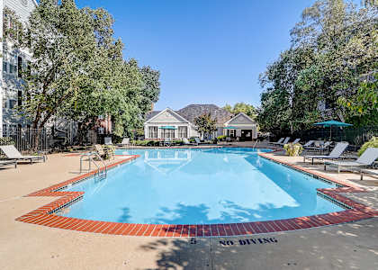 the preserve at ballantyne commons resort style pool with chairs and trees