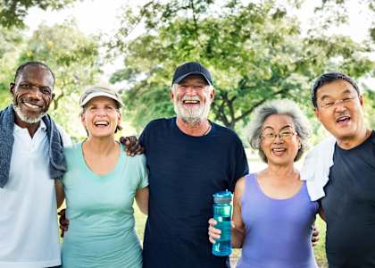 a group of people standing together in a park at 55+ FountainGlen Valencia, Valencia, CA, 91354