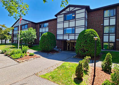 Exterior of the tudor style Country Park apartment building