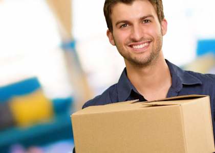 Man holding a box at BLUE RAVINE SELF STORAGE, Folsom, 95630