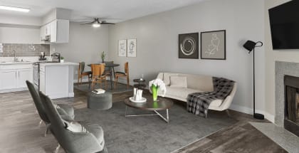 Model Living Room and Kitchen/Dining Room Area with Wood-Style Flooring at Meadow Ridge Apartments in Las Vegas, NV-HERO.