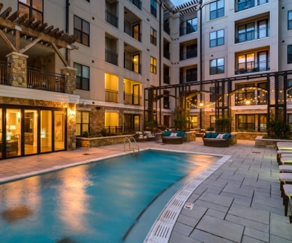 Swimming Pool with Lounge Seating with leasing office exterior at Berkshire Dilworth, Charlotte, North Carolina