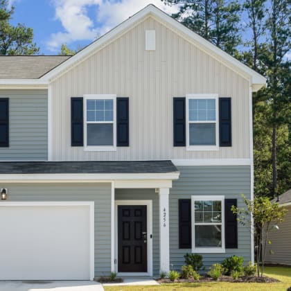 the front of a home with a two car garage at Beacon at Ashley River Landing, South Carolina
