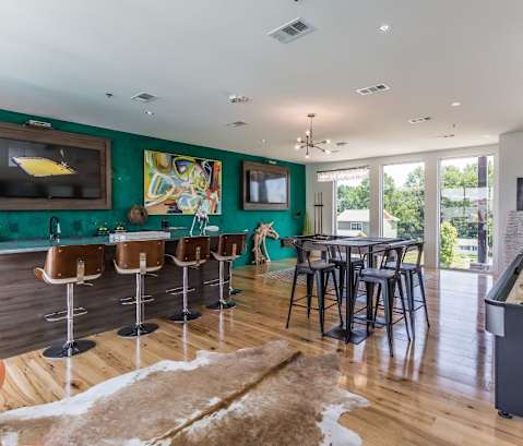 a game room with a pool table and a foosball table