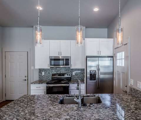 a kitchen with a sink and a refrigerator