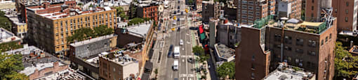 A city street with cars and buildings.