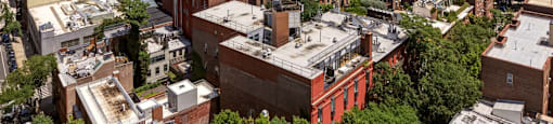 A cityscape with a mix of residential and commercial buildings.