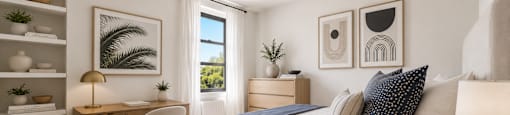 A bedroom with a bed, desk, chair, and shelves.