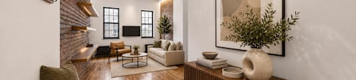 A living room with a brown sofa and a wooden cabinet.