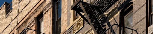 A building with a fire escape on the side.