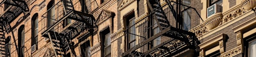 A building with a fire escape on the side.