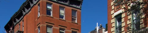 A street view of a crosswalk and buildings.