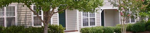a house with a tree in front of it