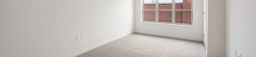 Bedroom with Plush Carpeting at Alo Apartments in Buffalo MN
