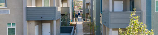 a row of apartment buildings with balconies at Loma Villas Apartments, California, 92408