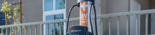 a gas pump in front of an apartment building at Loma Villas Apartments, San Bernardino