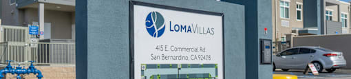 an image of a sign with a building in the background at Loma Villas Apartments, San Bernardino, 92408