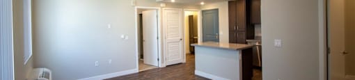 living room with a kitchen in the background at Loma Villas Apartments, San Bernardino, 92408