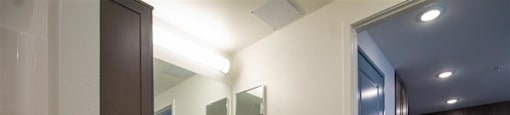 a bathroom with a sink and a mirror at Loma Villas Apartments, San Bernardino, 92408
