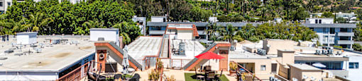 Rooftop deck with orange railings and hillside views at Joro Properties Apartments, Hollywood, CA 90046
