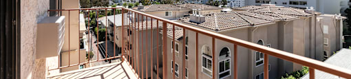 Private balcony with cityscape and apartment views at Joro Properties Apartments, Hollywood, California