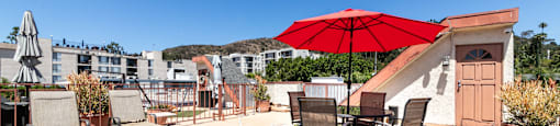 Rooftop deck with artificial turf and outdoor furniture at Joro Properties Apartments, Hollywood, CA