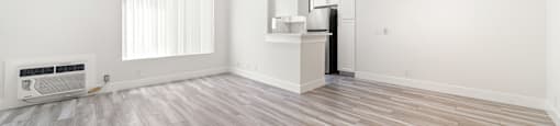Open studio with kitchen and laminate flooring at Joro Properties Apartments, Hollywood, California