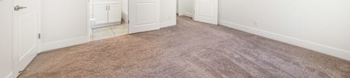 Empty bedroom with ensuite bathroom and walk-in closet at Joro Properties Apartments, Hollywood, 90046