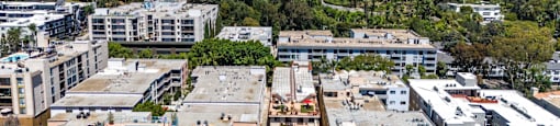 Aerial view of modern apartment community and hollywood hills at Joro Properties Apartments, Hollywood, 90046