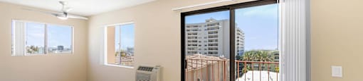 Empty studio with sliding glass door to balcony at Joro Properties Apartments, Hollywood, 90046