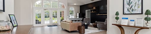 clubhouse with a sitting area, a TV and a kitchen area