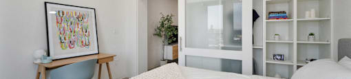 a bedroom with a large bed and a white closet
